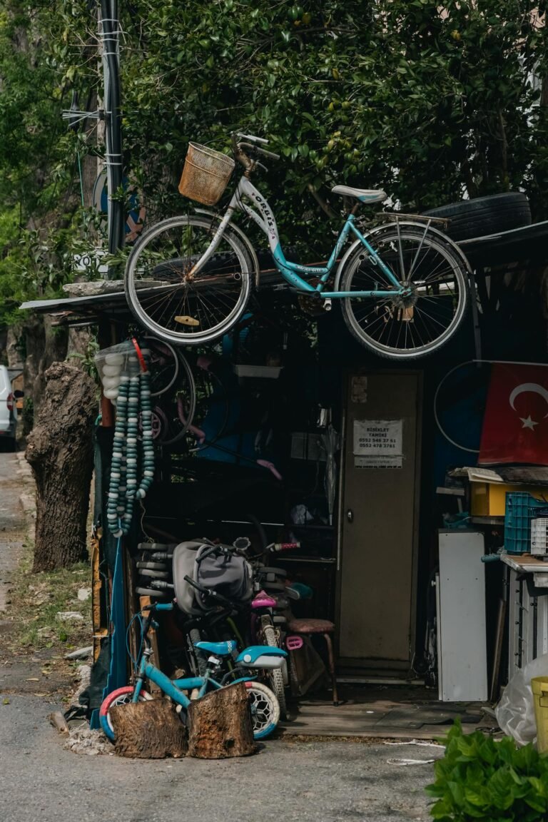 Charming outdoor bicycle repair shop with vintage bicycles and Turkish flag backdrop.